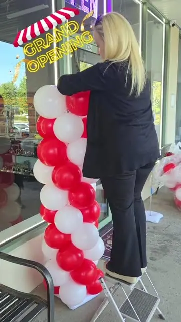 Grand opening balloon columns at a storefront by The RB Designs