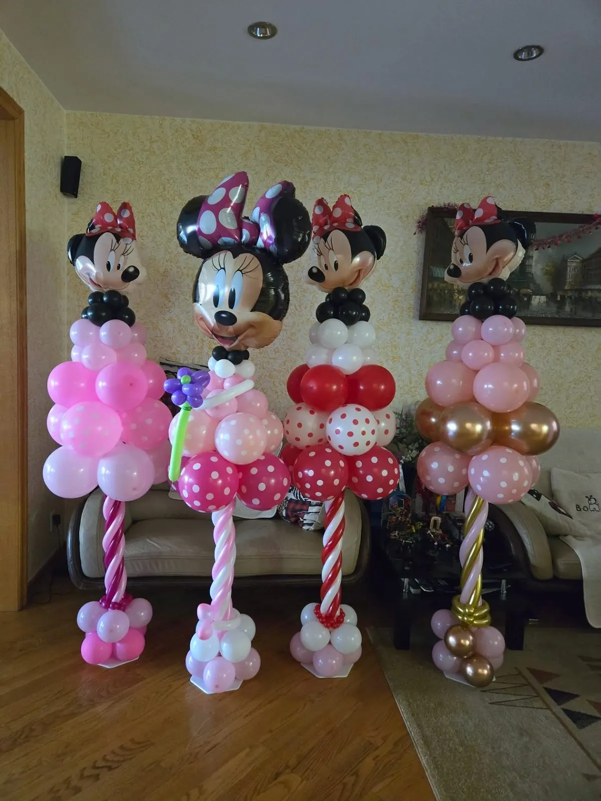 Pink and gold balloon columns at a first birthday by The RB Designs