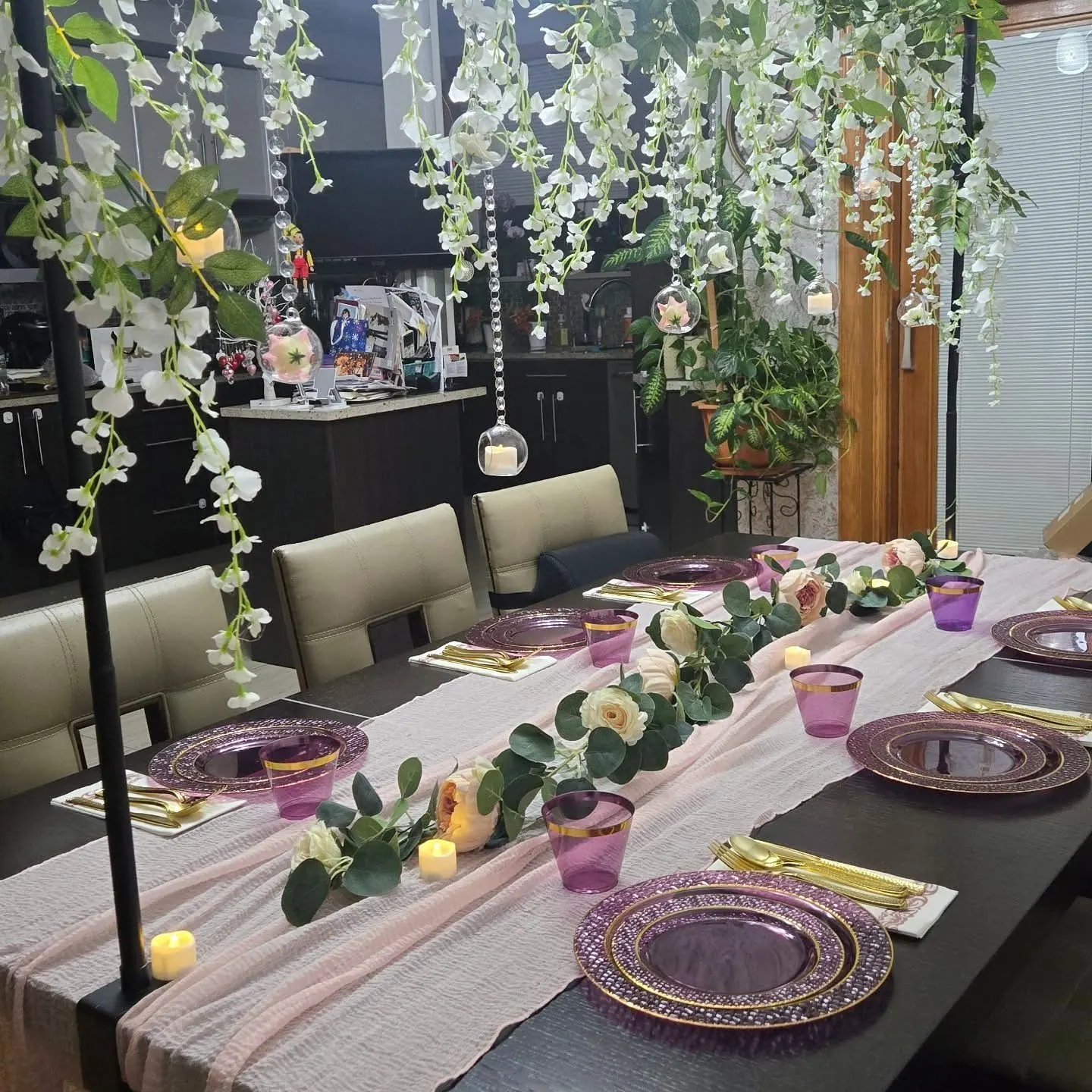 Elegant table setting with florals and candles by The RB Designs