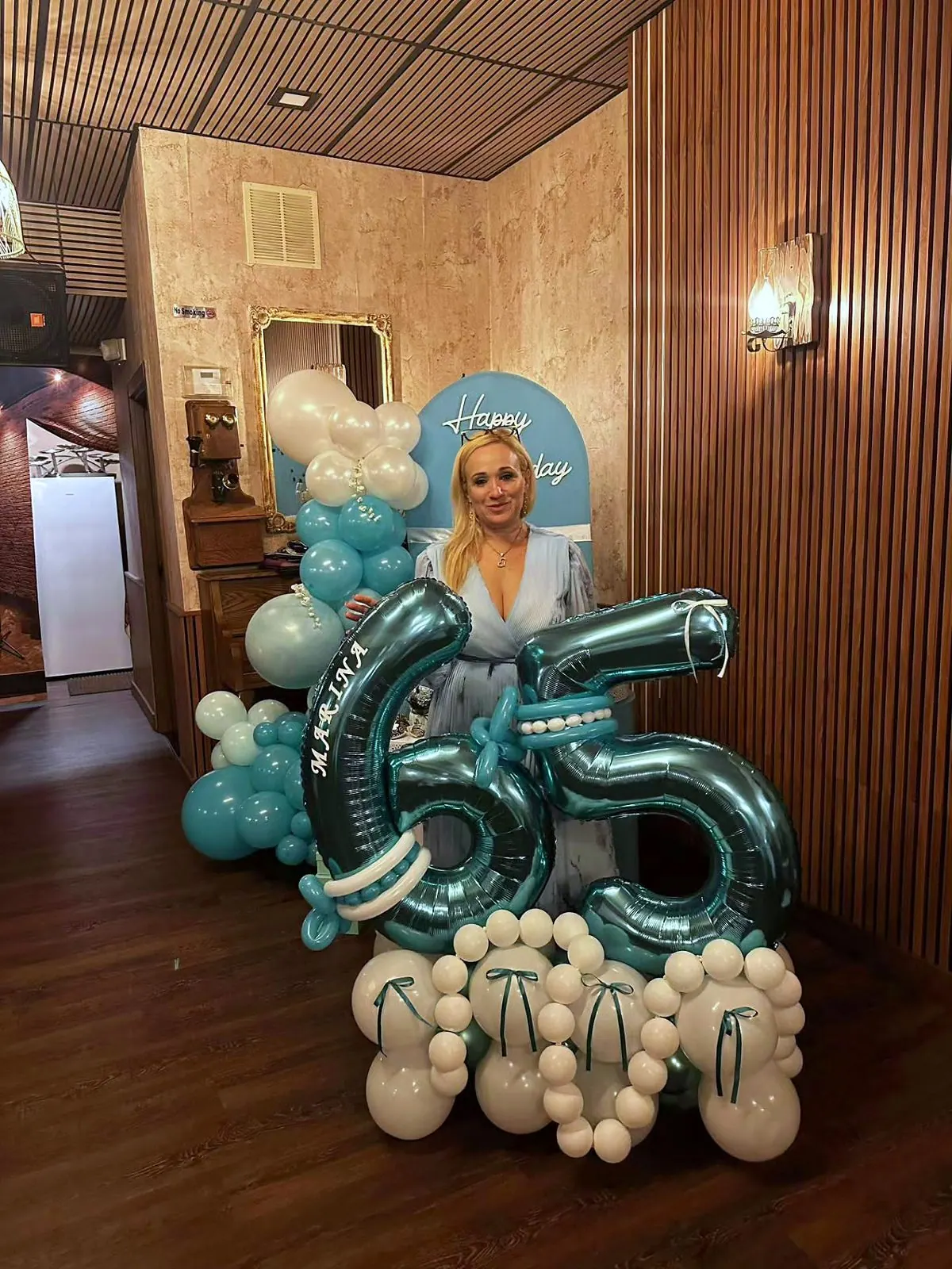 Tiffany-blue balloon decor for a 65th birthday by The RB Designs